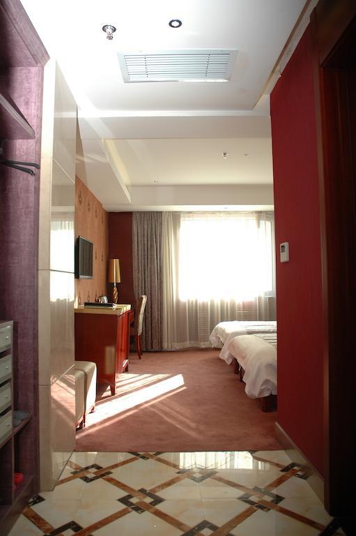 Harbin Yakelai Holiday Hotel Habitación foto